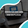 image d'un ordinateur avec une notification de mail avec le titre envoyer des sms via outlook